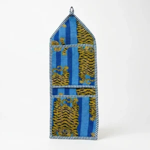 Close-up of the handcrafted blue jungle print detailing, dense quilted stitching texture lines, robust pocket seam attachments, and clean pocket opening on the cotton pocket storage.