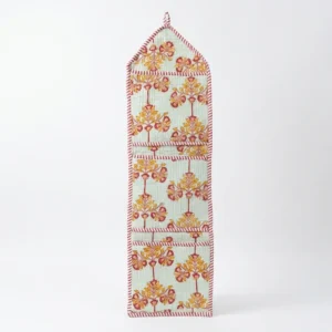 Close-up of the handcrafted botanical print detailing, dense quilted stitching texture lines, robust pocket seam attachments, and clean pocket opening on the cotton pocket storage.