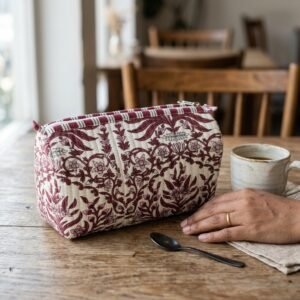Floral Quilted Toiletry Bag Set showing the nested 3-piece handmade travel pouch bundle with the traditional floral hand block print design and secure zipper tracks.