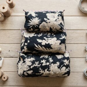 Close-up of the largest case in the Floral Quilted Toiletry Bag Set opened to reveal the clean protective inner lining, smooth zipper track, and soft quilted horizontal stitching texture.