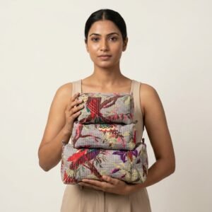 Grey Bird Quilted Toiletry Bag Set showing the nested 3-piece handmade travel pouch bundle with the traditional avian hand block print design and secure zipper tracks.