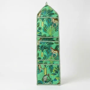 Close-up of the handcrafted jungle print detailing, dense quilted stitching texture lines, robust pocket seam attachments, and clean pocket opening on the cotton pocket storage.