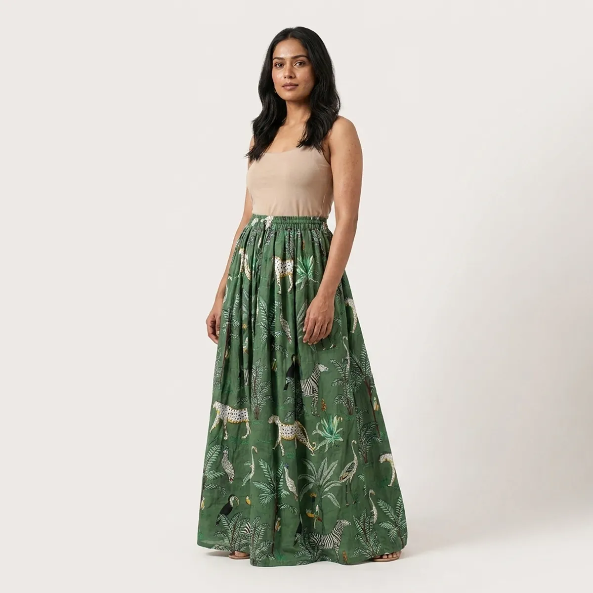 Close-up of the handcrafted green safari print detailing, rich fabric texture folds, and precise lock-stitched hem on the breathable cotton long bottom.