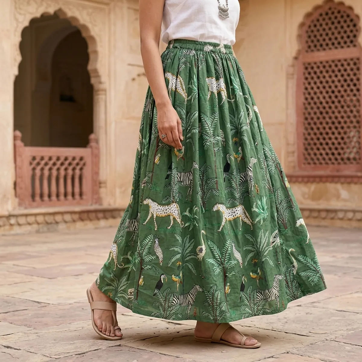 Green Safari Printed Cotton Maxi Skirt displaying the flowing flared silhouette and handcrafted exotic wilderness block print pattern on an outdoor model.