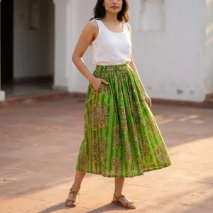 A beachside resort setting showing the gypsy boho female apparel skirt paired with sandals, highlighting its relaxed fit and elegant bohemian holiday style.