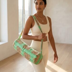 Green Tiger Quilted Yoga Mat Bag displaying the traditional wild cat hand block print artisan design with the spacious 27x6 main barrel zipper track open and reinforced wide shoulder sling handle.