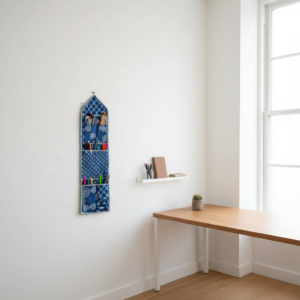 Indigo Blue Fabric Wall Hanging Organizer showing the traditional hand block print geometric design with 3 spacious front storage pockets and top hanging loops.