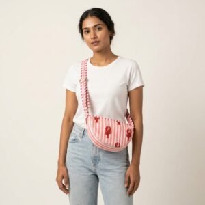 Lobster Print Quilted Crossbody Bag showing the traditional hand block print artisan design with the unique crescent silhouette and long adjustable shoulder strap.