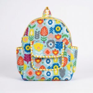 Close-up of the handcrafted colorful block print floral detailing, dual open side pockets, zipped front storage pouch, and dense quilted stitching texture lines on an Indian cotton mini travel rucksack.