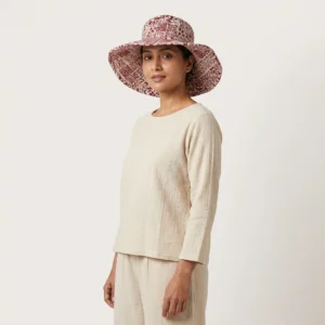 Maroon Floral Quilted Cotton Sun Hat showing the wide brim bucket cap frame with the handcrafted deep maroon botanical block print detailing.