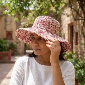 Maroon Floral Quilted Cotton Sun Hat showing the wide brim bucket cap frame with the handcrafted deep maroon botanical block print detailing.