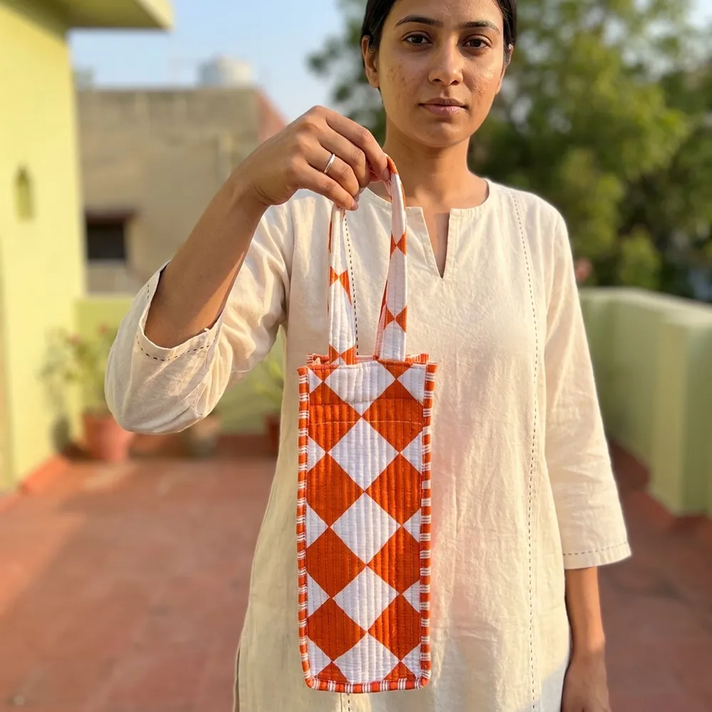 Orange Diamond Quilted Water Bottle Bag showing the thick hand-quilted cotton textile structure and comfortable top carry handle with a travel flask inside.