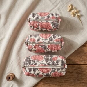 Close-up of the largest case in the Pink Floral Quilted Toiletry Bag Set opened to reveal the clean protective interior lining, smooth zipper track, and soft quilted horizontal stitching texture.