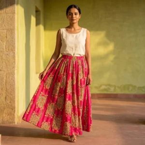 A beachside resort setting showing the gypsy boho female apparel skirt paired with sandals, highlighting its relaxed fit and elegant bohemian holiday style.