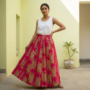 Pink Tiger Printed Cotton Maxi Skirt displaying the flowing flared silhouette and handcrafted exotic wilderness block print pattern on an outdoor model.
