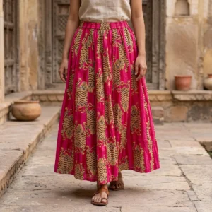 Pink Tiger Printed Cotton Maxi Skirt displaying the flowing flared silhouette and handcrafted exotic wilderness block print pattern on an outdoor model.