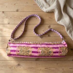 Close-up of the handcrafted purple wild cat stripe print detailing, dense quilted stitching texture lines, robust handle strap attachments, and secure opening layout on an Indian cotton Pilates carrier bag.
