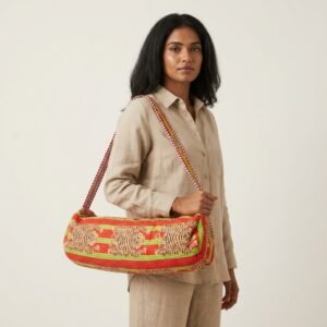 Close-up of the handcrafted exotic crimson and emerald cat print detail, dense quilted stitching texture lines, heavy-duty border trim, and clean inner layout on an Indian cotton Pilates carrier bag.