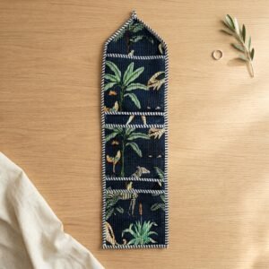 Close-up of the handcrafted jungle print detailing, dense quilted stitching texture lines, robust pocket seam attachments, and clean pocket opening on the cotton pocket storage.