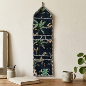 Close-up of the handcrafted jungle print detailing, dense quilted stitching texture lines, robust pocket seam attachments, and clean pocket opening on the cotton pocket storage.
