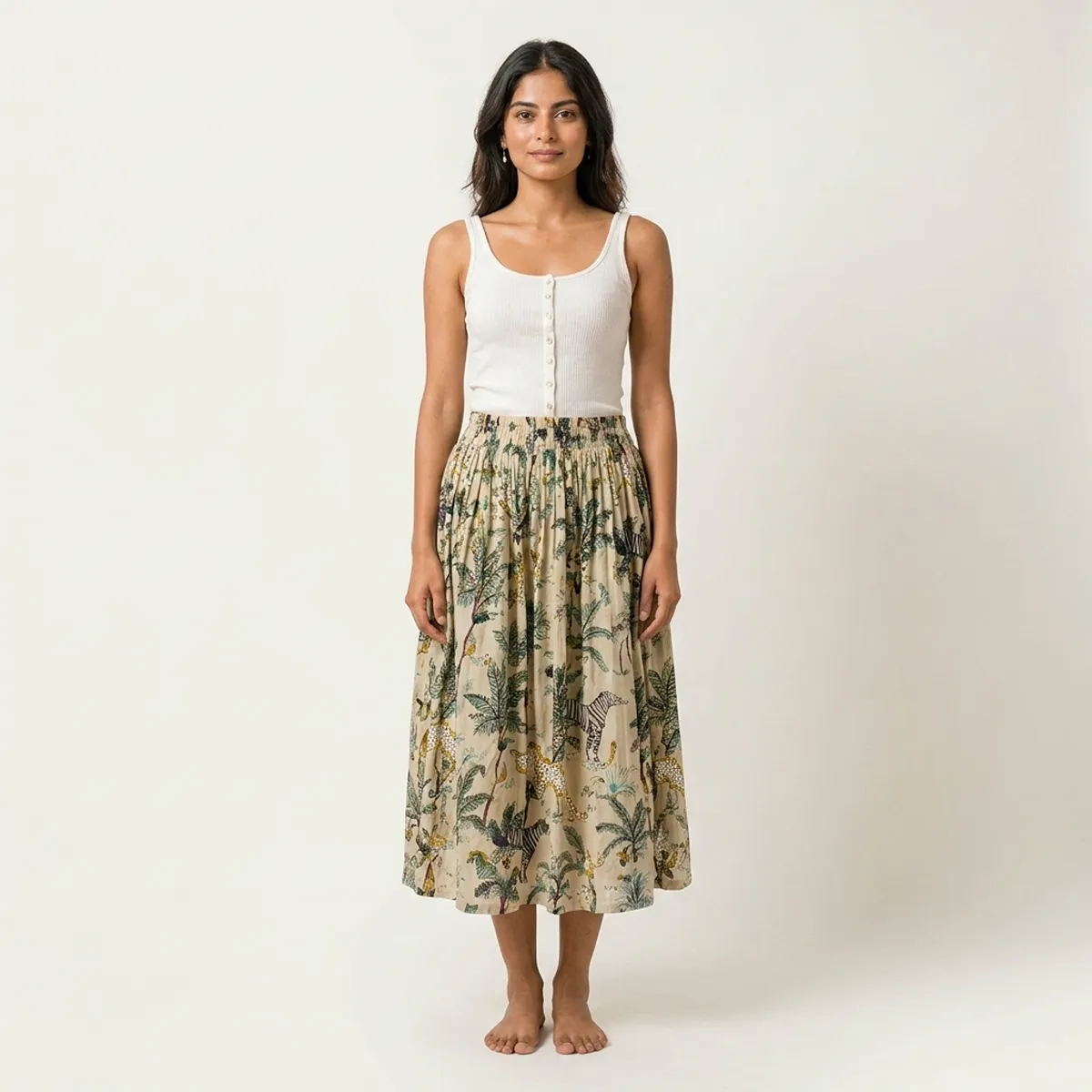 Close-up of the handcrafted safari print detailing, rich fabric texture folds, and precise lock-stitched hem on the breathable cotton summer clothing.
