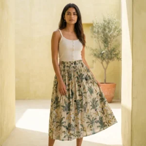 Safari Print Cotton Midi Skirt displaying the flowing flared silhouette and handcrafted exotic wilderness block print pattern on an outdoor model.