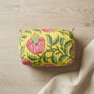 Set of Three Quilted Cotton Makeup Bags showing the nested 3-piece handmade travel pouch bundle with the traditional pink poppy hand block print design and handcrafted tassel pulls.