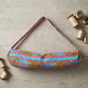 Close-up of the handcrafted exotic cat print detail, dense quilted stitching texture lines, heavy-duty border trim, and clean inner layout on an Indian cotton Pilates carrier bag.