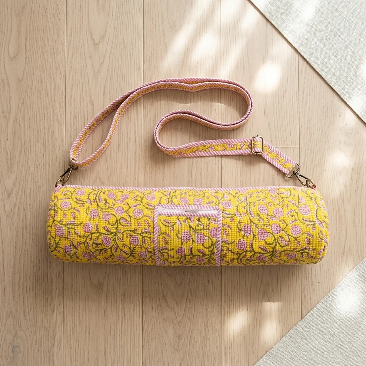 Close-up of the handcrafted pink striped border detailing, dense quilted tracking lines, robust zipper attachment, and durable cross-stitched shoulder strap joints on the fitness handbag.