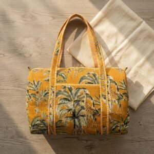 Close-up of the handcrafted jungle print detailing, wild cat motif layers, dense quilted stitching texture lines, robust handle attachments, and smooth zipper closure track on an Indian cotton travel weekender.