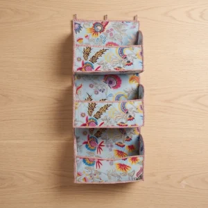 Handmade quilted cotton hanging wall organizer with blue floral print and five tiered storage pockets