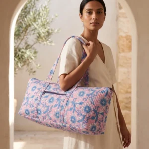 Pink Floral Quilted Cotton Yoga Mat Bag showing the cylindrical shoulder carrier design with the handcrafted botanical floral block print pattern and spacious zip opening.