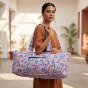 Pink Floral Quilted Cotton Yoga Mat Bag showing the cylindrical shoulder carrier design with the handcrafted botanical floral block print pattern and spacious zip opening.