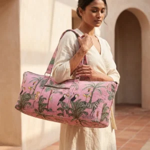 Close-up of the handcrafted wild cat accent detailing, dense quilted tracking lines, robust stitch seams, and durable shoulder carry handles on the fitness tote.