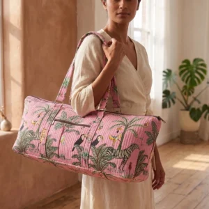 Pink Zebra Quilted Cotton Yoga Mat Bag showing the cylindrical shoulder carrier design with the handcrafted zebra pattern print and spacious zip opening.