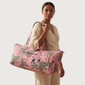 Pink Zebra Quilted Cotton Yoga Mat Bag showing the cylindrical shoulder carrier design with the handcrafted zebra pattern print and spacious zip opening.