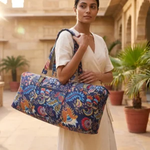 Quilted Cotton Yoga Mat Bag showing the cylindrical shoulder carrier design with the handcrafted floral block print pattern and spacious zip opening.