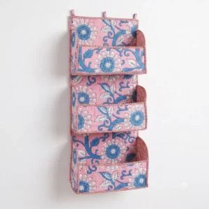 Handmade cotton hanging wall organizer with pink blue floral print and three tiered storage pockets