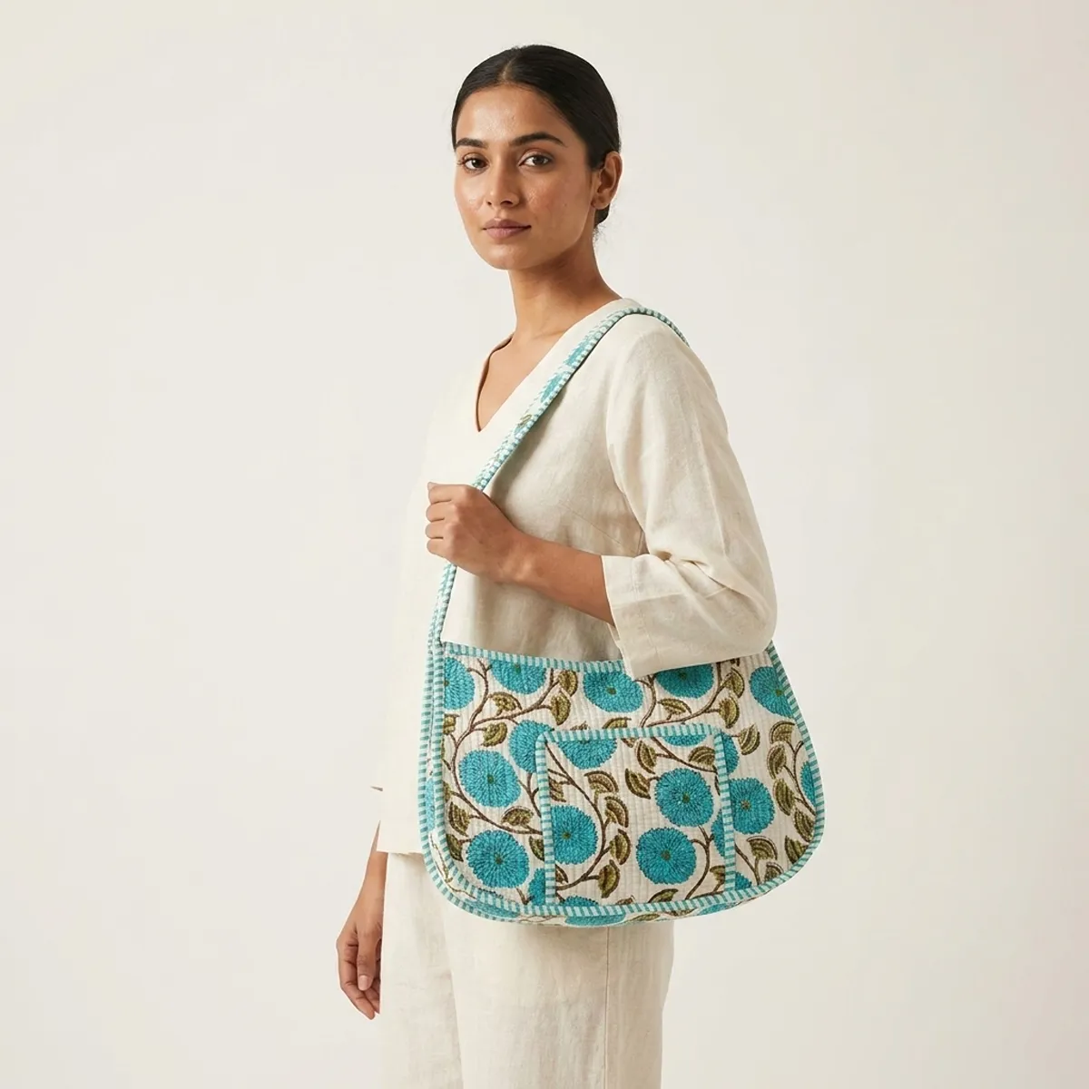 Handmade quilted cotton shoulder bag with turquoise floral botanical print